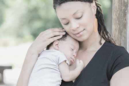 woman of colour holding new baby