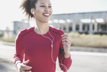woman running with headphones in
