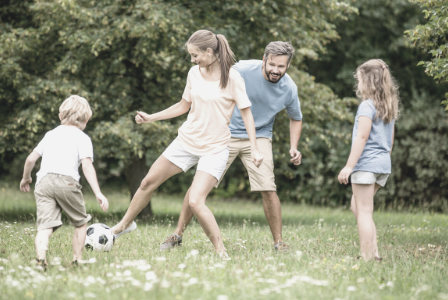 family playing football