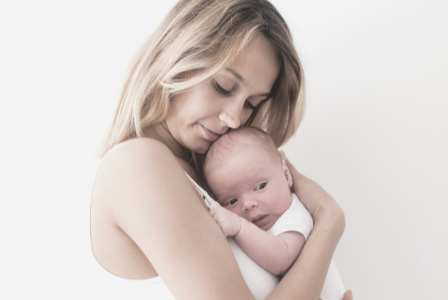 woman holding new baby